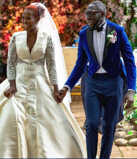 Photos of Sauti Sol’s Polycarp Otieno exchanging vows with his Burundian sweetheart in a white wedding