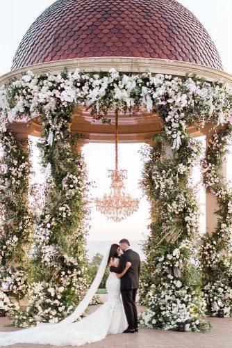 wedding decor 2019 tall gazebo decorated with greenery white flowers and gold chandelier bretthickmanphoto