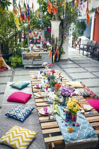 wedding decor 2019 bright boho reception with palette table flowers feathers and pillows karaspartyideas