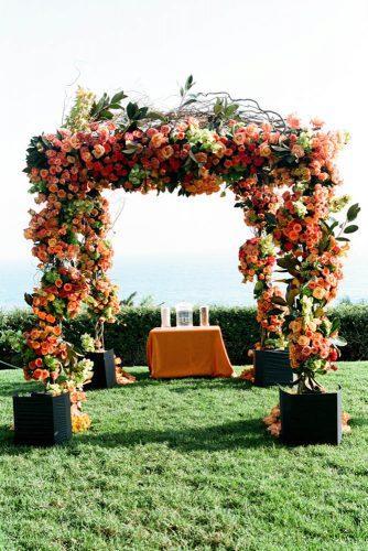 wedding decor 2019 orange roses and green leaves altar yvette roman photography