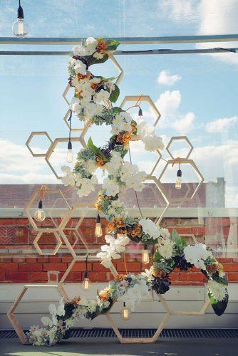 wedding decor 2019 geometric wooden backdop with light bulbs and white orchids flowers hikari