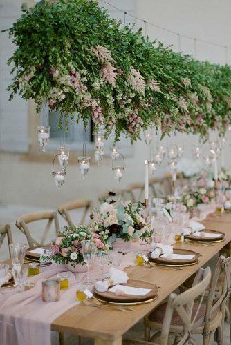 wedding decor 2019 hanging bold greenery with flowers and candles above the table gregfinck