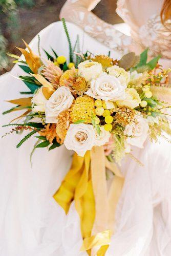 wedding colors 2019 mustard yellow flowers in bridal bouquet with ribbons love by serena