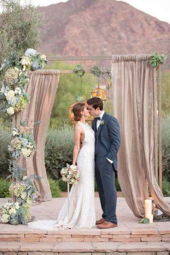 wedding colors 2019 dusty pink arch with cloth succulents and hanging geometry amy and jordan photography