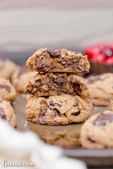 These Cranberry Pecan Chocolate Chip Cookies are gooey in the middle with perfectly crispy edges. Think: your favorite chocolate chip cookie, dressed up with dried cranberries and toasty pecans. I recommend devouring one of these gluten-free, paleo, and vegan cookies warm from the oven.