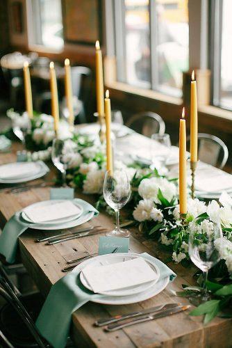 mustard wedding candle decor for rustic table with greenry tablerunner laura ivanova photography