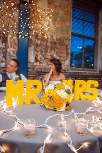 mustard wedding table decor with letters mr and mrs bridal bouquet urban safari