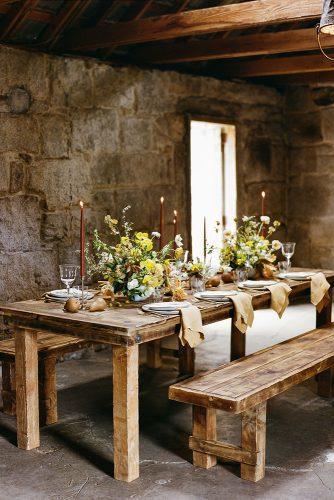 mustard wedding rustic table decor wih flowers and candles taken by sarah photography