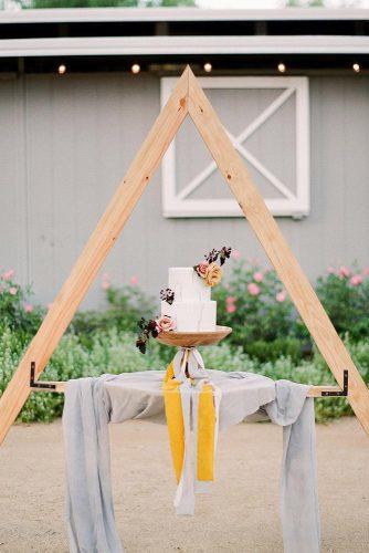 mustard wedding minimalistic dessert table with marble cake michellebeller
