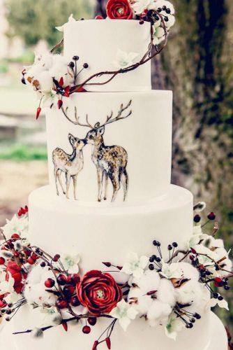 christmas wedding tall white cake with red flowers cotton flowers and painted deers elenstudiophotography