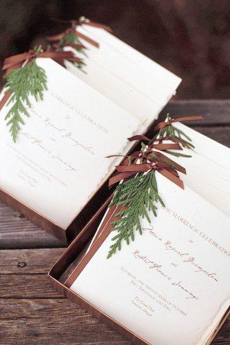 christmas wedding invintations decorated with pine branches and brown ribbon maura mcevoy