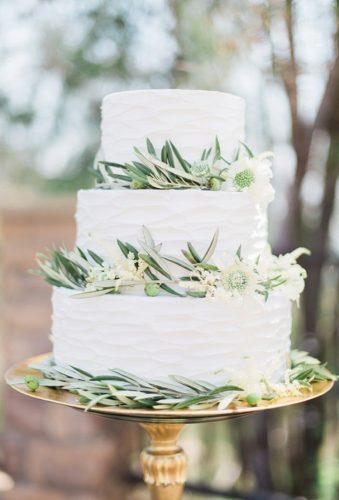 bohemian wedding cakes cake with greenery Stephanie Ponce Photography