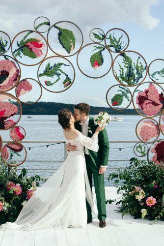 dusty rose wedding bridal arch with canvas flowers and greenery artem vindrievsky
