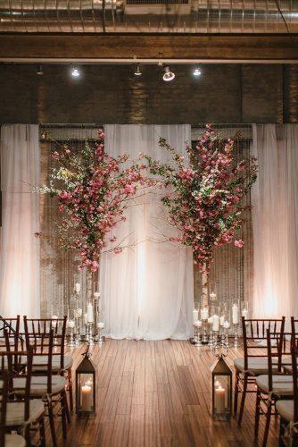 dusty rose wedding rustic arch with trees love me do photography