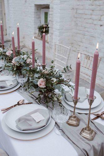 dusty rose wedding candles and flowers centerpiece on gray tablerunner agnes black