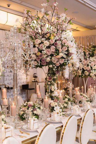 dusty rose wedding luxury with tall flower centerpieces and candles luminous_weddings