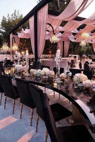 dusty rose wedding modern tent with geometry decor and chic chandeliers revelryeventdesign
