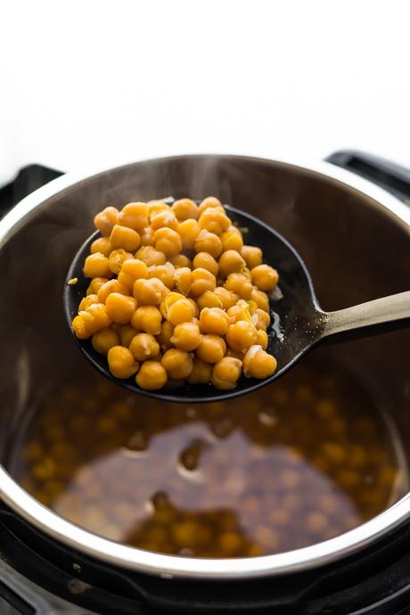 instant pot chickpeas scooped up on a spoon