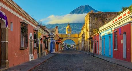 Enchanting Travels Guatemala Tours Antigua Cityscape in the main street of Antigua city with the Agua volcano in the background