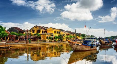 Enchanting Travels Vietnam Tours Hoi An Wooden boats on the Thu Bon River in Hoi An Ancient Town (Hoian), Vietnam.