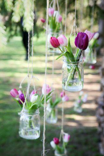 spring wedding decor pink lilac tulip in hanging glass jar lisa berry