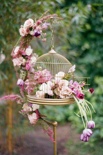 spring wedding décor hanging cage gold with roses tulips flowers and greenery the ganeys