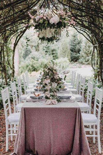 spring wedding decor bridal table with roses under branches tent outdoor lisa kathan photography