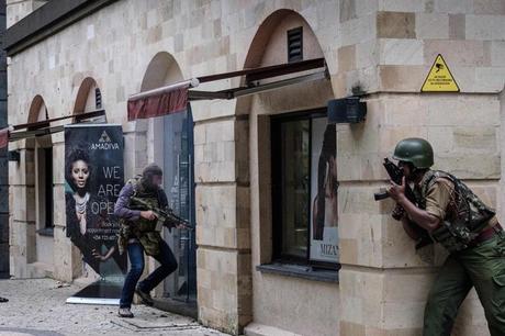 SAS soldier prepares to storm into DusitD2 hotel as a member of Kenyan special forces watches 