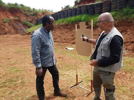 Inayat Kassam and Jeff Koinange atÂ a shooting range