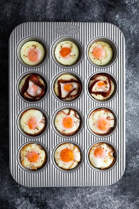 overhead view of baked eggs in a muffin tin