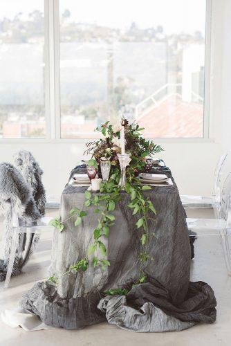 silver sage wedding tablecloth and greenery on bridal table anna delores photography