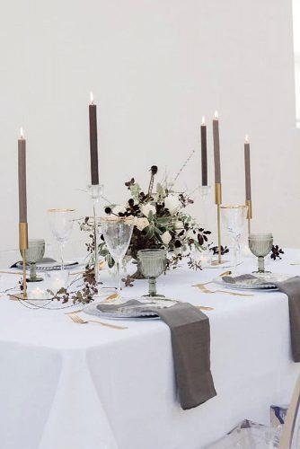 silver sage wedding gray napkins candles and glasses on white table flower centerpiece hannahmcclunephotography