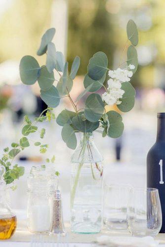 silver sage wedding eucalyptus leaves in glass bottle centerpiece figlewicz photography