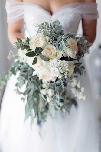 silver sage wedding bouquet with white roses and cascading greenery clareece smit photography