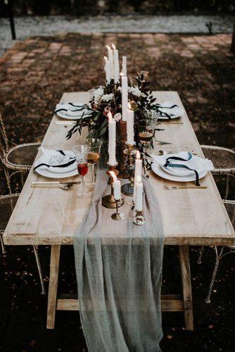 silver sage wedding wooden outdoor table with candles and greenery centerpiece yeray cruz