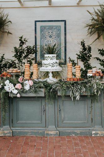 silver sage wedding wooden buffet decorated with blush roses and greenery white michellelillywhite