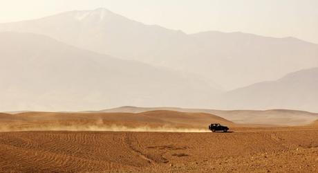 Vehicle driving through Agafay desert, Morocco