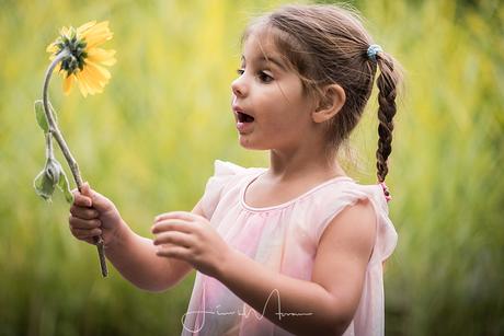 Girl playing with flower