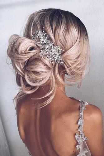 bohemian wedding hairstyles volume high messy bun with silver accessorie ulyanaasterbridal