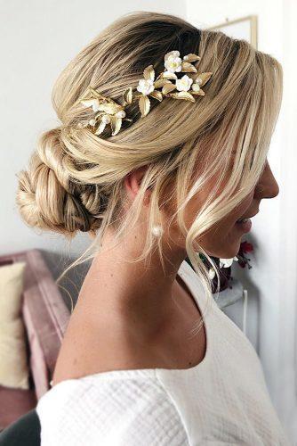 bohemian wedding hairstyles simple low messy bun and loose curls elegant side gold accessorie caraclynebrida