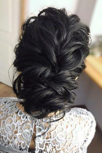 bohemian wedding hairstyles textured wavy low bun on black medium hair julia_alesionok