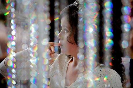 young girl at a wedding with sparkles