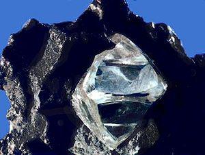 Nearly octahedral diamond crystal in matrix.