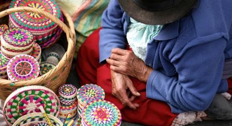 Handmade wicker boxes being sold at a traditional market in Cuenca