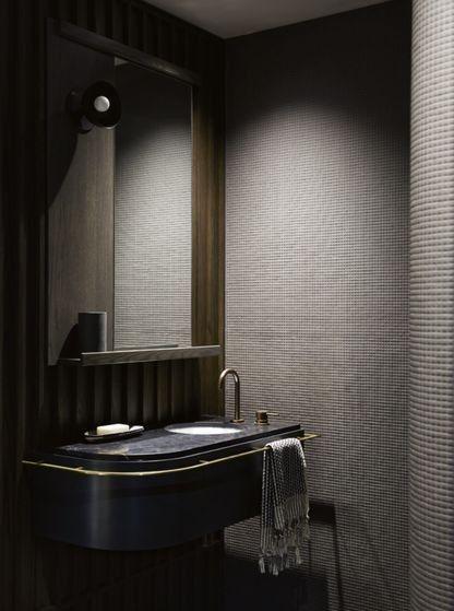 dark bathroom with gray walls 