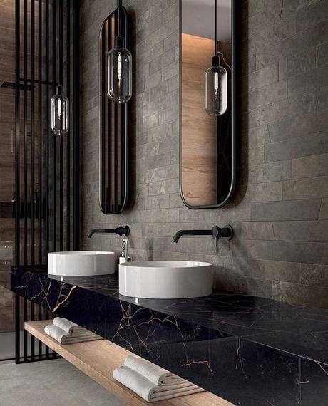 black stone bathroom vanity with double white vessel sinks and matte black sink hardware