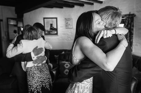 a bride hugging her father at a cley windmill wedding