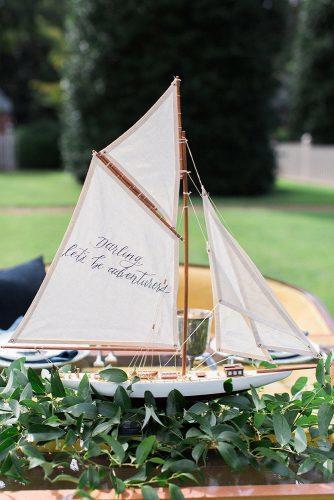 nautical wedding decor ship with white sails and the inscription nikki santerre