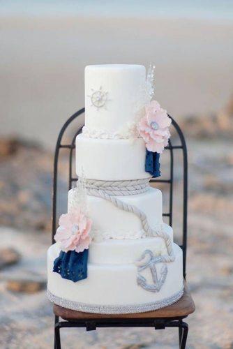 nautical wedding tall white cake with pink flowers rope and anchor maria sundin photography