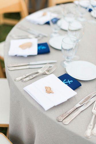 nautical wedding table grey round with seashells in plates leila brewster photography